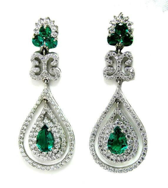 Diamond & Emerald Creation 21.72ct 14k W/G Overlay: Gem Type: Diamond and Emerald Creation Quantity: 1 pair Diamond Creation Weight: 7.58 carat round brilliant Clarity: SI1 Color: H-I Corundum Emerald Weight: 14.14 carat oval and pear shape Clarity: VS