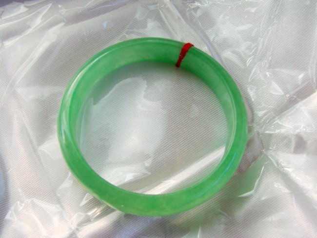 Natural Jade Bangle JBA-1B Size: 6.5: Gem Type: Natural China Culture Jade Item: Jade Bangle,JBA-1B Color: Green an texture Transparency: Semi-Transparent Shape-Cut:Solid Jade Band Haft Always Round Jade Finish: Hand cut and hand High Pol
