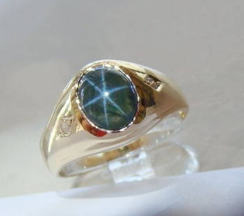 Man Blue Star Sapphire Ring: 2.05CtD:.08Ct 14KY/G: Gems: Natural Cabochon Star Sapphire White Diamond Item: Ring (Size: 8) Weight: .08 carat 2 Pieces Round brilliant Clarity SI3, Color: H, Treatment: None Center: Cabochon Star Sapphire Weight: 2.05 ca