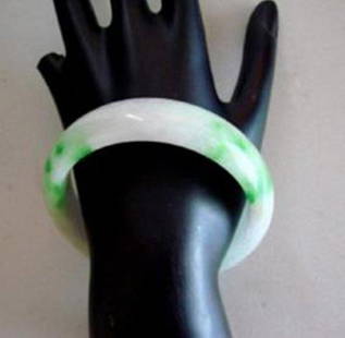 Natural Jade Bangle Grade A Size: 6.5: Remarks: Natural Jadeite Jade Item: Jade Bangle (Size: 6.5) Grade: A Weight: 64.30 gram Color: Emerald Green / Light Green Texture Transparency: Semi -Transparent Shape & Cut: Solid Jade/Halfway Round