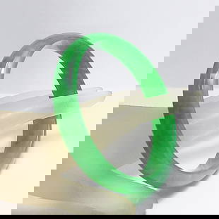 Translucent Solid Green Chinese Jade Bangle Size: 7.5: Gem Type: Natural Translucent Solid Chinese Jade Grade: B Item: Jade Bangle, Size 7.5 Outer Diameter: 68 mm Inter Diameter: 56mm Width: 13.3mm Thickness: 7 mm Weight 56.19 grams Treated: Untreat