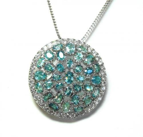 Natural Blue Zicorn Pendant 14.40 Ct 18k Antique Gold O: Gem type: Natural Blue Zircon and Creation Diamonds Item: Pendant or Brooch Blue Zircon: 32 Pieces Weight: 14.40 Carat Shape: Oval Facet (Clarity: SI, Color: Ocean Blue /Treatment: Heated) Measurement