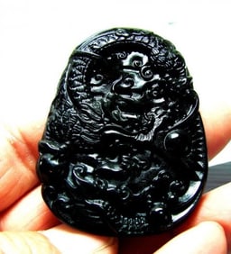 Onyx carving Dragon 114.45Ct 55x40x6.4mm