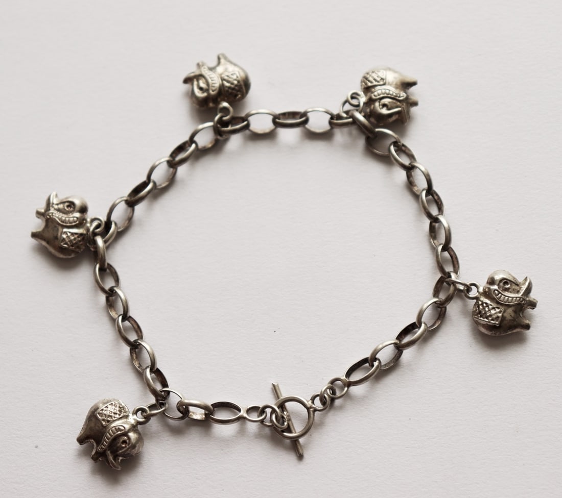 Elephant Bracelet Antique Handcrafts/925 Sliver: Elephant Bracelet Antique Handcrafts Size 8" Long Width: 12 mm Weight: 11 grams This item was made by Handcrafts Estimated Value Price: $1,450