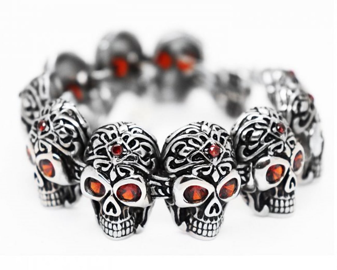 Man's Skull Stainless Steel Skull Bracelet/Garnet 10.54 Ct: Gem Type: Natural Red Garnet Weight: 15.54 Carat size: .52mm x.05mm Shape/Cut: Round, Facet, Clarity: VSI, Color: Dark Red Quality: 1 Item: Skull Bracelet Weight: 102 grams Width: 25 mm Thickness: 7