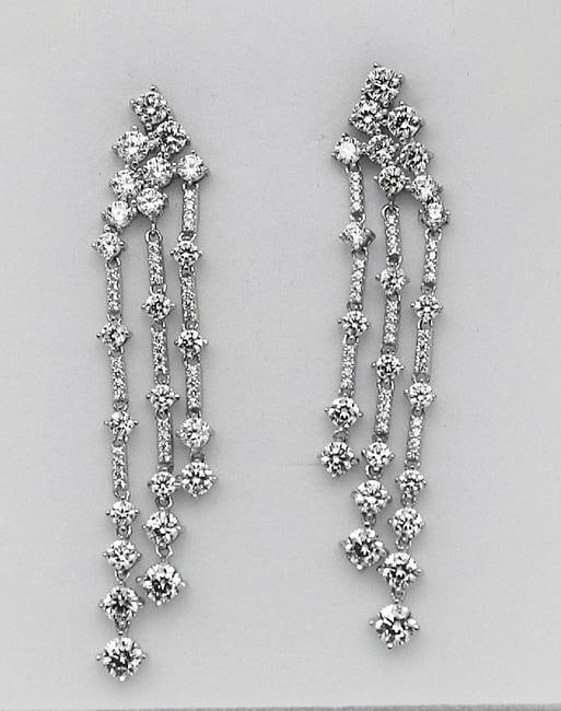 Chandaliar Creation, Diamond 18k W/G Overlay: Gem Type: Creation, Diamonds High Quality Item Item: Earrings White Stone Total Weight: Approx. 3.10 Carat Clarity: VVS, Color: F Metal: 9.075 grams 18k White Gold Overly 925 Backing: Post-backing Len