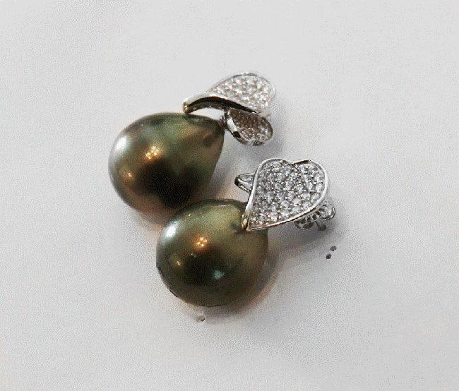 Baroque, Tahitian Pearl Earrings 18k W/g Gold Overlay: Gem Type: Tahitian Pearl/ Creation whit Diamond Stones Total: Approximately 1. Carat, Clarity: VS1, Color: F Pearl: Luster: very good, Size: 14 mm Color: Black/Gray/Light Green Length: 1. Inches Width
