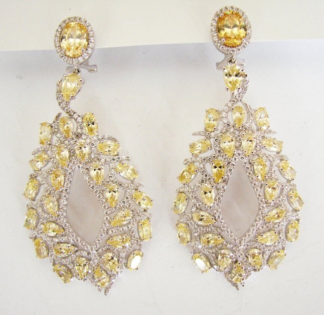 Creation,Diamond Fancy Earri 18.49Ct 18k W/g Overlay: Gem Type: Creation, Diamond Fancy Yellow and White Qty: 1 Pairs, Item: Earrings Stone total weight: 18.49 carat White stones: 7.10 carat round brilliant Clarity: VVS, Color: F Creation Fancy Yellow 11