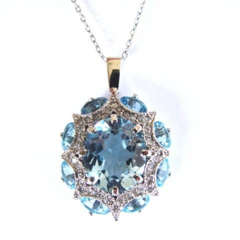 Blue Topaz Pendant 14.25 CT DIA: .91CT 14K W/g: Elegant Blue Topaz Pendant Setting with Diamond Natural Blue Topaz: 14. 25 carat oval shape Center: 4.25 carat oval shape Blue Topaz Surrounding natural: 10.00 carat oval shape Color: Light Blue Origi