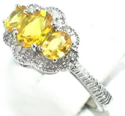 Anniversary Yellow Sapphire Diamond Ring 1.40CT 14k W/g: Diamond: .30 carat round brilliant (Clarity: SI-1, Color: H, Treatment: None) Sapphire: 1.10 carat oval Facet Clarity: SI, Color: Yellow, Treatment: Heated Origin: Tanzania Hardness: 9 Metal: