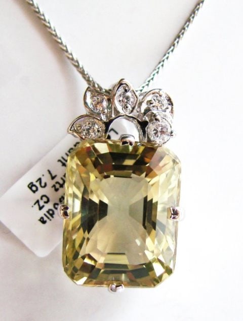 Lemon Topaz Pendant 14.10CT W/G Overlay: Gem Type: Natural Lemon Topaz/Creation Diamond Quantity: 1 Lemon Topaz: Approx14.10 Carat (Cushion Cut, Facet, Size: 14x10x6mm) Clarity: VS1, Color: Medium Yellow, Treatment: None Hardness 7 Origin, B