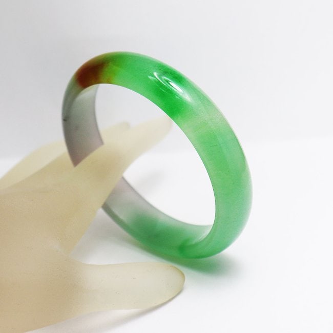 Translucent Solid Multi-Color Chinese Jade Bangle: Gem Type: Natural Translucent Solid Chinese Jade Grade: B Item: Jade Bangle, Size 7 Outer Diameter: 75 mm Inter Diameter: 60mm Width: 15. mm Thickness: 8. mm Weight : 47.20 grams Treated: