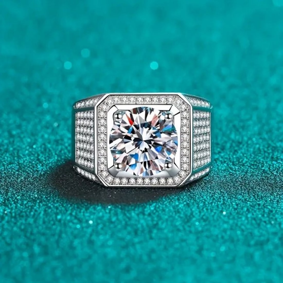 Men Moissanite Ring 5 CT 18k W/g Overlay 925: Men Moissanite Ring 5 CT 18k W/g Overlay 925 Item: Ring, Size: 8 Width: 13 mm Center: 5 Carat, Clarity: VVS, Color: F Mounting: 1. Carat round Brilliant, 134 pieces Creation Diamonds Metal: 18k white