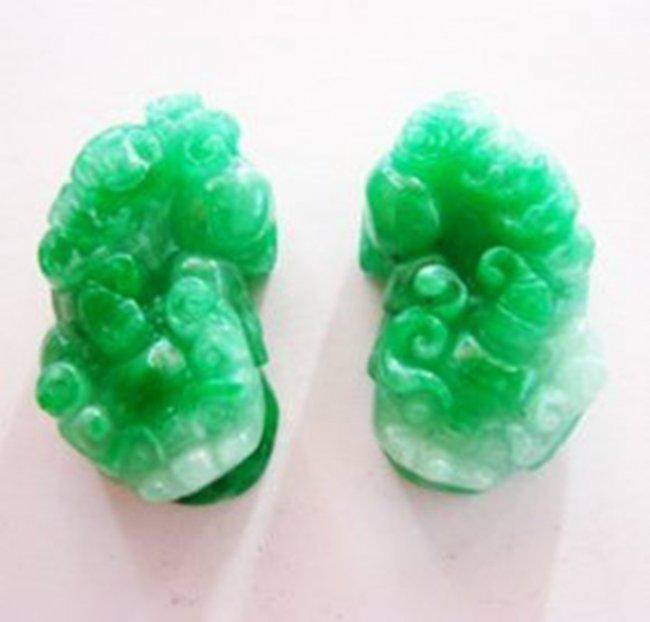 Handmade Antique Pairs of Chinese Fool Dogs: Gem: Natural Jadeite Jade Items: Carved Fool Dogs Quantity: 1 pair Grade: A Weight: 46.95 grams Color: Green, Slightly white, texture Measurement: L 40mm x W 22mm x Thickness 13.8mm Estimated Value Pr