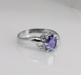 Anniversary Pinkish Violet Sapphire Diamond Ring 1.30Ct 14k W/g: Gem Type: Natural Tanzanite/Diamond Item: Ring, Size: 6.5 Diamond: 4 pieces, Weight: .09 carat round brilliant Clarity: SI2, Color: H, Treatment: None Center: 1.21 carat, Cut: Oval, Facet Measurement: