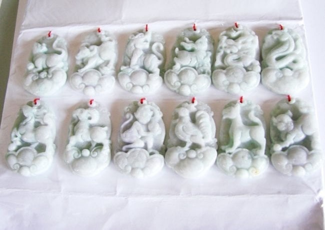 Year Set 12 Zodiac Animals Green Jadeite Necklaces: A Set of 12 Chinese Zodiac Animals of Rat Ox Tiger Rabbit Dragon Snake Horse Goat Monkey Rooster Dog Pig 12 Pieces Pendant Weight 125.60 grams Grade B Shape Oval Measurement Length 40mmx Width