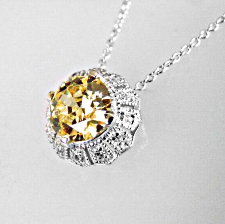 Creation Diamond/ Necklace 2.03CT 18k W/G Overlay: Gem: Creation Diamond Qty: 1 Length: 18" Pendant size: 14x14mm Item: Pendant Stone weight: 2.03 carat round brilliant Clarity: VVS1 Color: Fancy light yellow Metal: 18k white gold overlay 925