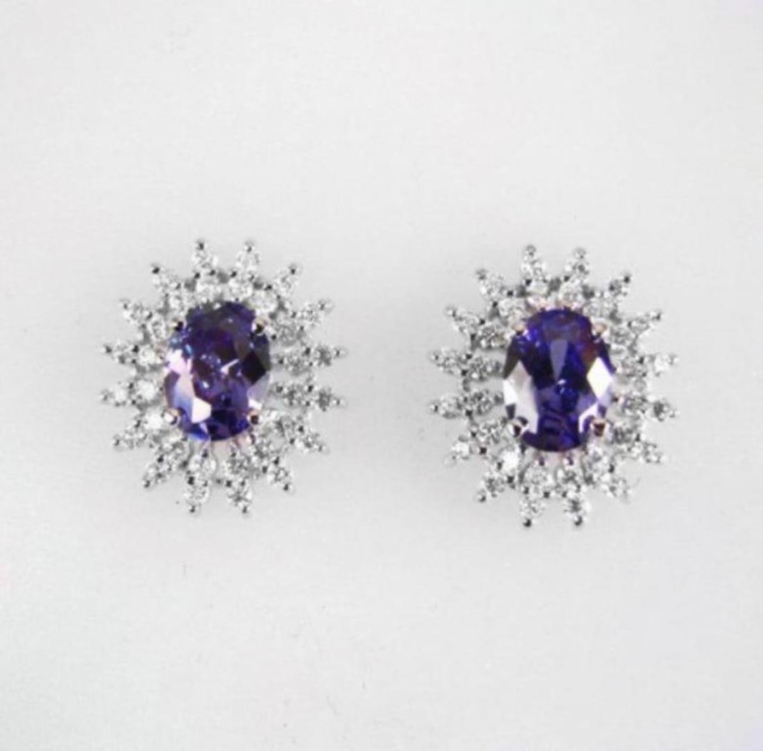 Creation Diamond/Tanzanit Earrings 3.25Ct 18k W/g Overlay: Gem: Creation Diamond/Tanzanite Qty: Pairs Item:Earrings Center stone: 2.29 carat pear shape, size 9x7mm (Clarity: VSI, Color: Dark Violet Blue) Creation Diamond: 1.00 carat round (Clarity: VSI,