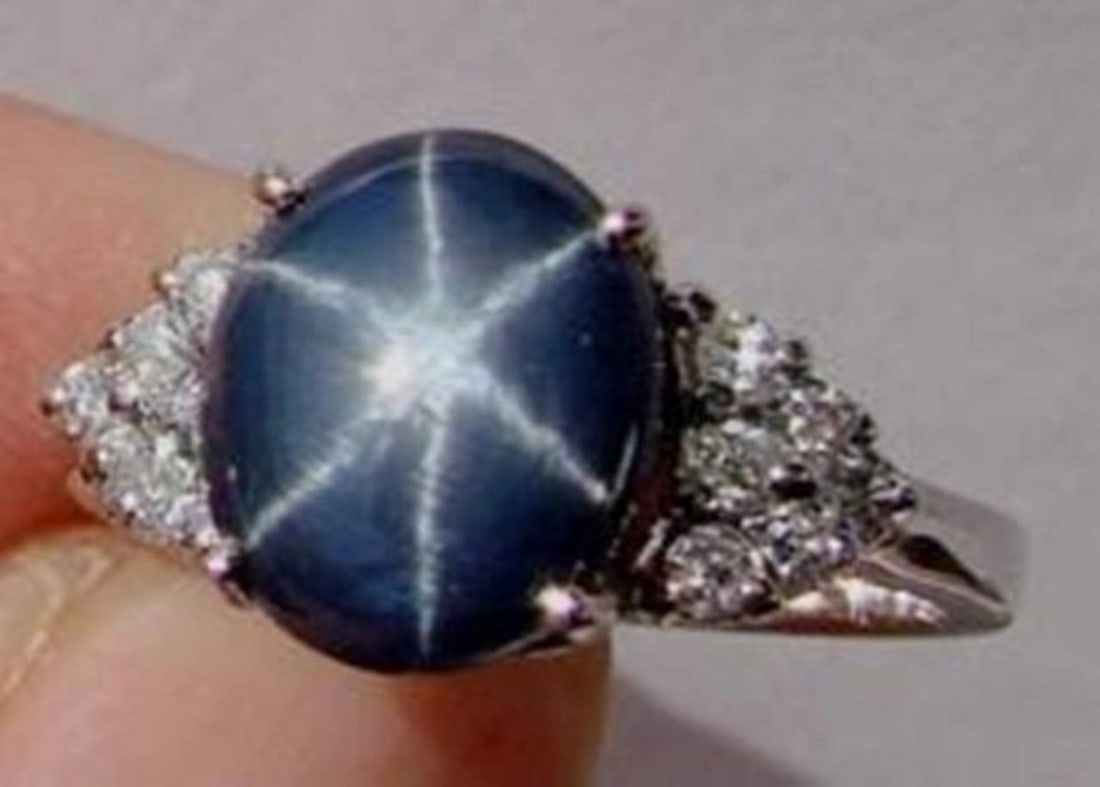 Star Sapphire Ring 3.24Ct & Diamond .42Ct 14k W/g: Gem Type: Natural Star Sapphire and Diamond Item: Ring (Size: 6.5) Band thickness: 2-3mm Total diamond weight: .42 carat round brilliant Clarity SI2, Color: H, Treatment: None Star Sapphire: 3.24