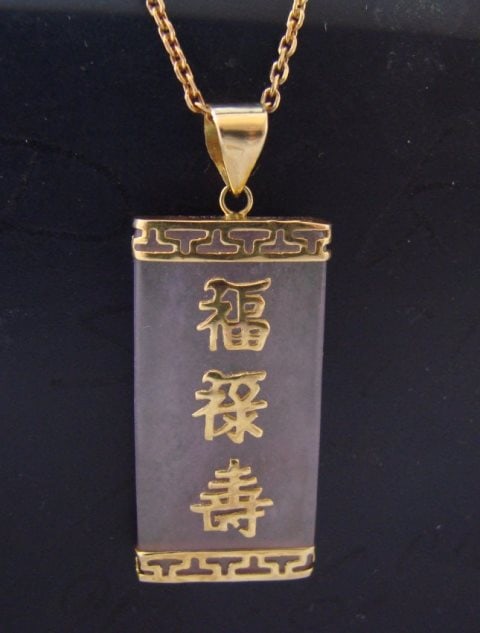 Lavender Jade Pendant Has chianese Letter 14k Y/g: Gem Type: Natural Jade Item: Pendant Size: 1.2" length x1/2 width x 2mm depth Quantity: 1 Grade: B Clarity: Transparent Color: Natural Lavender 14k solid yellow gold and (2.75grm) Pendant will come w