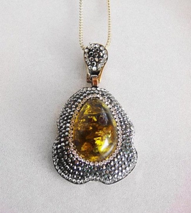 Amber Pendant 36.21 Carat 18k R/g Overlay: Gem Type: Natural Amber, Ruby and Creation Diamond, Hematite Crystals Qty: 1 Item: Pendant Creation, Diamond: 1.88 carat round brilliant Clarity: VVSI, Color: G Hematite Crystals: 4.32Carat Clarity: O