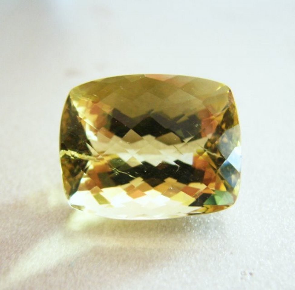 Loose Natural Lemon Topaz Cushion Shape 24.77Ct: Gem Type: Natural Lemon Topaz Weight: 24.77 Carat Measurement: 24.5x15.5x11.6 mm Shape: Cushion Checkerboard Clarity: VS-Color: Light Yellow Origin: Brazil Estimate Value Price $1,858