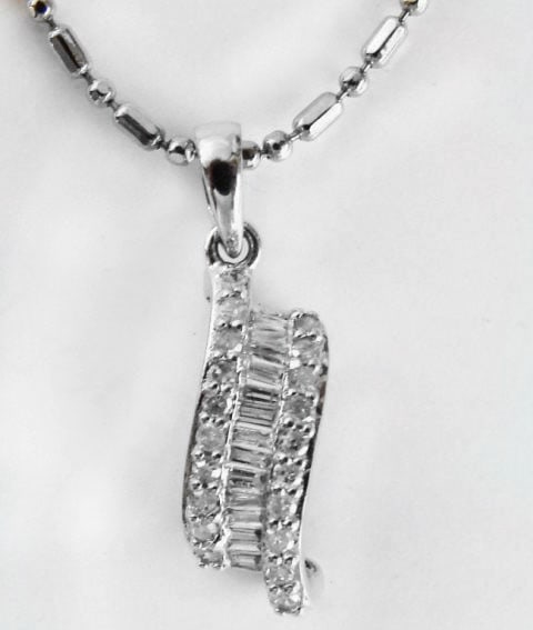 Diamond Unique Pendant: .62 Carat 14k W/g: Gem type: Natural Diamonds Item: Pendants Diamonds 20 Pieces Weight: .30 carat Round brilliant (Clarity: SI2/Color: H/Treatment: None) Diamond Baguette 14 Pieces Weight: .32 Carat (Clarity: