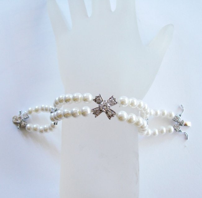 Bracelet Pearl Diamond Creation 4.65Ct 18k W/g Overlay: Gem Type: Swarovski Pearl and Diamond Creation Item: Bracelet (Length: 7) Diamond Creation Weight: 4.65 Carat Round Brilliant Clarity: VVS, Color: F Pearl: 7 mm Shape: Off Round Metal: 18k White Gold