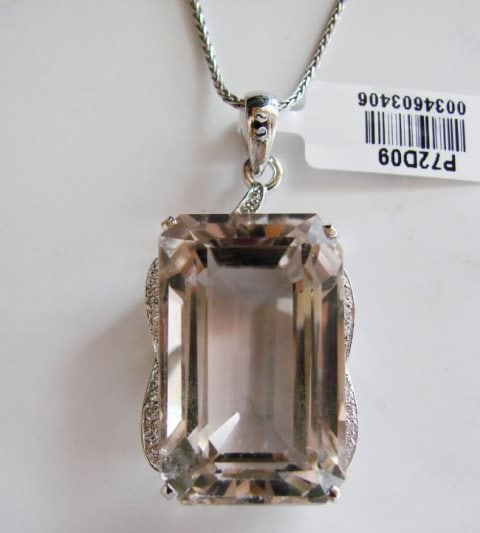 Smoky Topaz Pendant 38.00CT 18k W/g Overlay: Gem Type: Natural Smoky Topaz/Creation Diamond Quantity: 1 Smoky Topaz: Approx 38.00Carat (Octagon Shaped, Facet, Size: 22x14xx10mm) Clarity: VS1, Color: Light Brown, Treatment: None Hardness 7 Origin