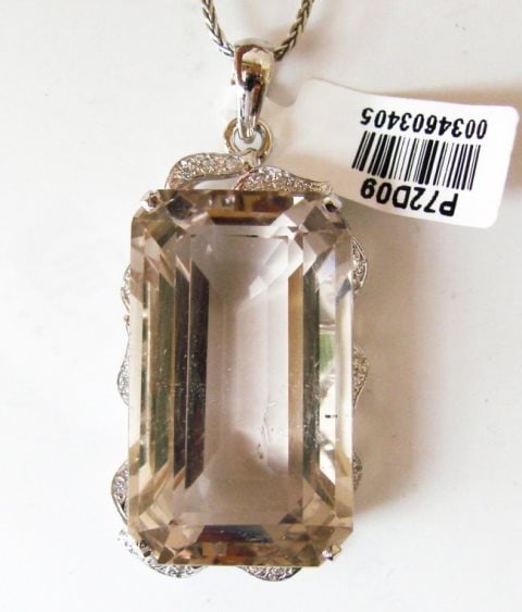 Smoky Topaz Pendant 47.09Ct 18k W/g Overlay: Gem Type: Natural Smoky Topaz/Creation Diamond Quantity: 1 Smoky Topaz: Approx 47.09Carat (Octagon Shaped, Facet, Size: 30x17.5x11.8mm) Clarity: VS1, Color: Light Brown, Treatment: None Hardness 7 Ori