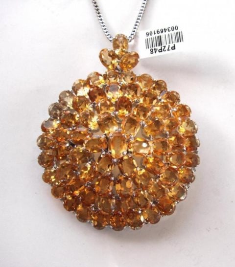 Citrine Pendant 62.78Ct 18k W/G Overlay: Gem Type: Natural Citrine Item: Pendant and Brooch Citrine: 73 Pieces Weight: 62.78 Carat (5x7mm) Oval Shaped Clarity: Transparent Color: Orange Cut: Faceted Hardness: 7-8 Origin: Brazil Face: