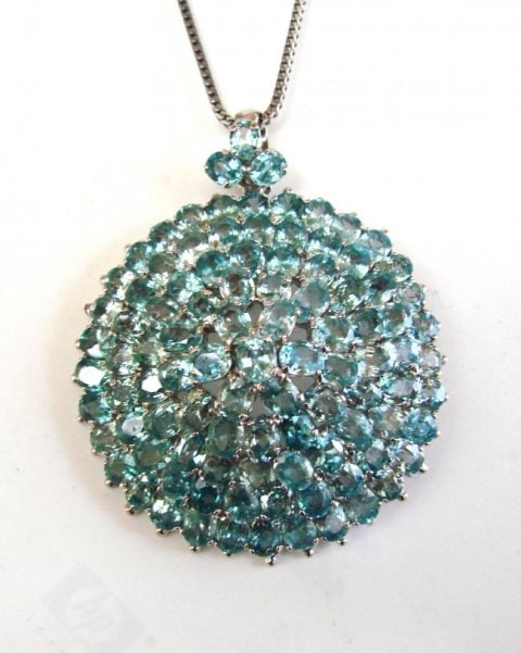 Natural Blue Zircon Pendant 69.30Ct 18k W/G Overlay: Gem type: Natural Blue Zircon and Creation Diamonds Item: Pendant or Brooch Blue Zircon: 99 Pieces Weight: 69.30 Carat