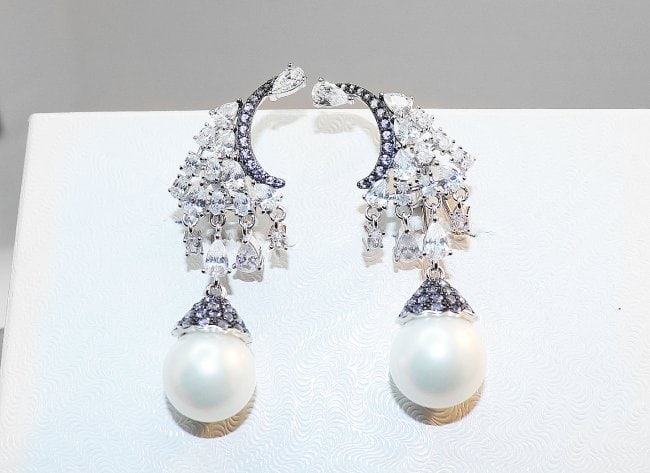 Creation Dia/ Swarovski Pearl /Blue Sapphire Earrings: Gem Type: Creation Diamond/ Blue sapphire/ Swarovski Pearl Item: Earrings/Length: 2 inches, Width: 11mm White Stone: 1.10 Carat round brilliant Clarity: VS1 Color: G Blue sapphire: .25 Carat blue sapp
