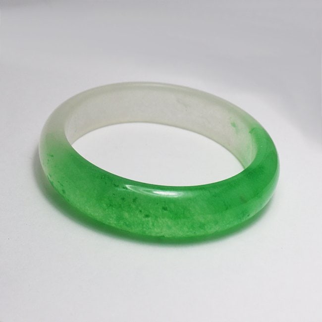 Translucent Solid Green/Creamy Chinese Jade Bangle: Gem Type: Natural Translucent Solid Chinese Jade Grade: B Item: Jade Bangle, Size 7 Outer Diameter: 75 mm Inter Diameter: 60 mm Width: 16 mm Thickness: 8 mm Weight 63.77 Treated: Untreated <b