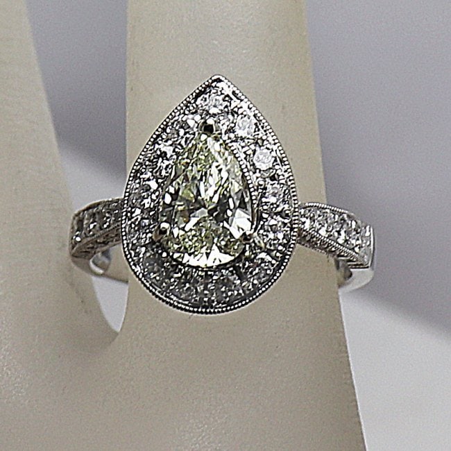 Engagement Ring Marquise 2.22 Carat 18k W/G: Gem Type: Natural Diamond Item: Engagement Ring, Size: 7 Center: 1.02 carat marquise shaped, Size: 8.4x5.4x3.2mm Clarity: VVSI, Color: H-I Small Diamond: 1.20 Carat round Brilliant Clarity: VSI, Color
