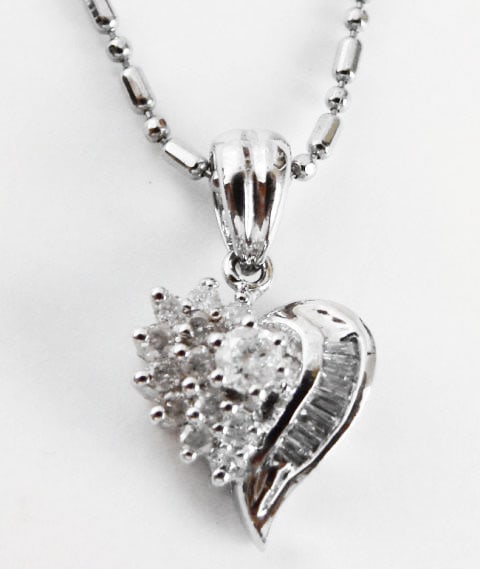 Diamond Heart Pendant: .35 Carat 14k W/g: Gem type: Natural Diamonds Item: Pendants Diamonds 13 Pieces Weight: .25 carat Round brilliant (Clarity: SI2, Color:H, Treatment: None) Diamond Baguette 7 Pieces Weight: .07 Carat (Clarity: SI1/Color