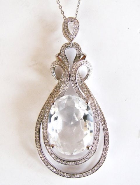 Creation Diamond-W/Sph Pendant 17.43Ct18k W/G Overlay: Creation Diamonds White Sapphire Pendant High Quality Item Item: Pendant Center Weight: 16.15 carat Oval Shape Clarity: VVS, Color: White Measurement:20x15x8 mm Mouthing Stones:1.28 Carat Round Brilli