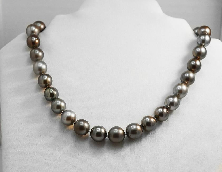 Tahitian Pearl Necklace 12.5 mm 14k W/G Ball Clasp: Gems Type: Natural Tahitian Pearl Grade: B-C, Color: Multi- Luster: Good- Shape: Round/ Off Round- Measurement: 12.5 mm 32 pieces Origin: Tahiti Necklace: 17 Inches Ball Clasp: 14k White