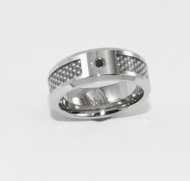 Man's Cobalt Eternity Band with Black Diamond: Item: Eternity Band High Polished Finish Beveled Edge One Black Diamond 2.1mm to 2.3 mm approx. On the center Setting: Bezel-Set Width: 8mm, Size: 9, Item: New
