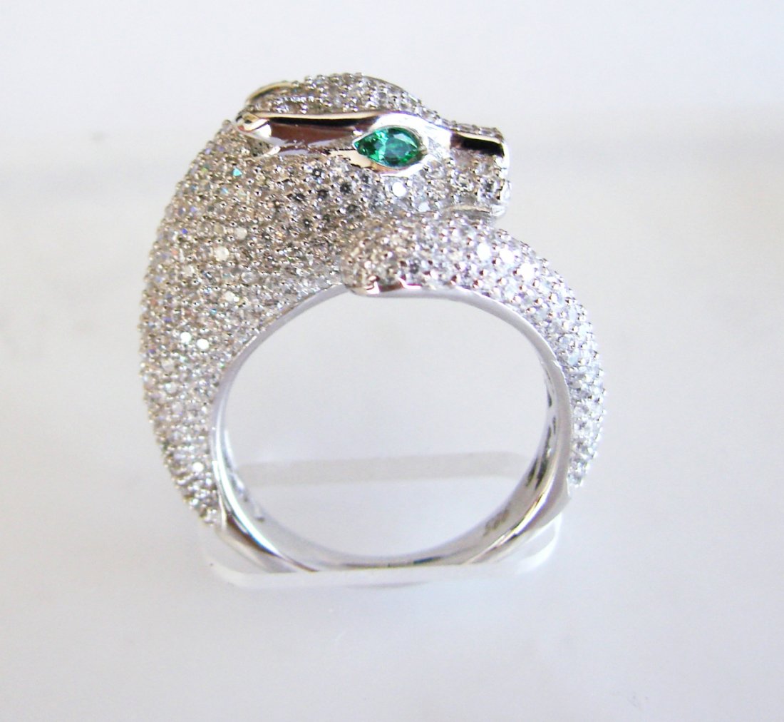 Creation Diamond Juguar Ring 3.65Ct18k W/g Overaly: Creation Diamond & Green Garnet Ring High Quality Item Item: Ring Weight:3.45 Carat Round brilliant Clarity: VVS,Color: F Green Garnet:.20 Carat Marquise Cut,Clarity:VVS,Color:Green Bend Thickness: 3-