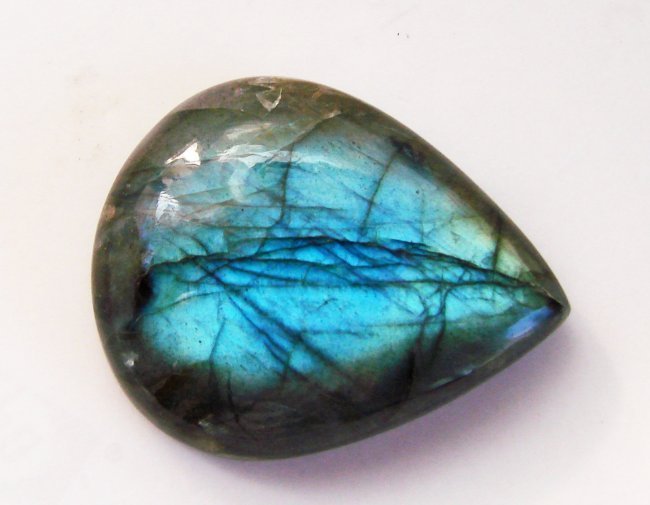 Multicolor Labradorite Pear Shape 49.03Ct40x26x8m: Gems Type: Natural Multicolor Labradorite Pear Shape Weight:49.03 Carat Size:40x26x8 mm Cut: Pear Shape Cabochon Clarity: Translucent Treatment: None Hardness:6 Origin: Madagascar Estimated Valu