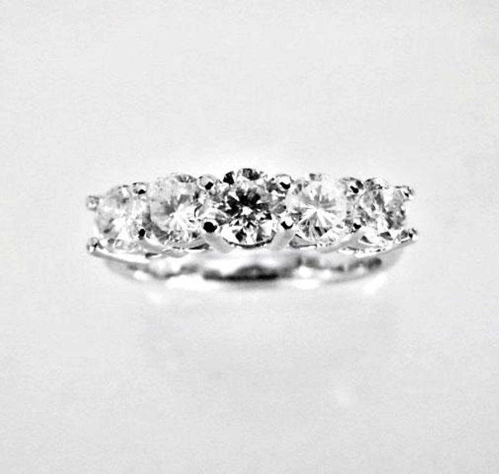 Engagement Ring : 1.67 Carat 14K White Gold: Gem Type: Natural Diamond Qty: 1 Condition: New Item: Ring (Size: 6.5) Band thickness: 3-4mm Total diamond weight: 1.67 carat 5 pieces round shaped Clarity: SI2,Color: H, Treatment: None Metal: 14k so