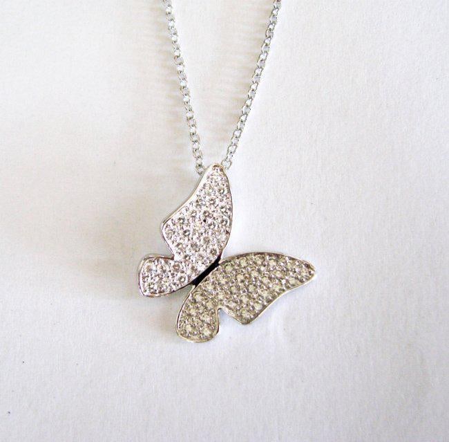 Creation Diamond Pendant Butterfly 1.12Ct 18k Wg Overlay: Creation Diamond High Quality Item Qty: 1 Item: Pendant Diameter: L 3/4" x W 3/4"inch 56 Pieces: 1.12 carat Round Brilliant (Clarity: VVS, Color: F) Setting name: Micro Pave 18k White gold Overlay 925