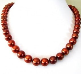 Chocolate Culture Pearl Necklace & Silver Ball Clasp: Gem: Freshwater Culture Pearl Pearl: size: 9-10mm Color: Chocolate Luster: A Lenght: 17 inches knot: Between each pearl, Threat: Silk Metal: Silver ball Clasp Condition: New Estimated Value Pric