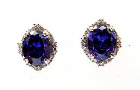 Creation Diamond/Tanzanite Earrings 7.44Ct 18k W/g Overlay: Gem: Creation Diamond/Tanzanite Item: Earrings Center stone: 6.74 carat oval shape, size 10x8mm (Clarity: VSI, Color: Dark Violet Blue) 28 Pieces Creation Diamond: .70 carat round (Clarity: VSI,