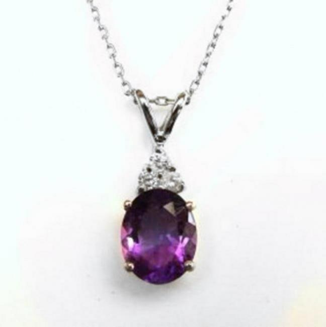 Diamond Amethyst Pendant 3.07Ct 14k W/G: Gem Type: Diamond Amethyst Item: Pendant Diamond 3 Pieces Weight: .20 Carat Round Brilliant Clarity: SI2, Color: H, Treatment: None Amethyst Weight: 2.87 carat Oval shaped/Facet cut Measurement: