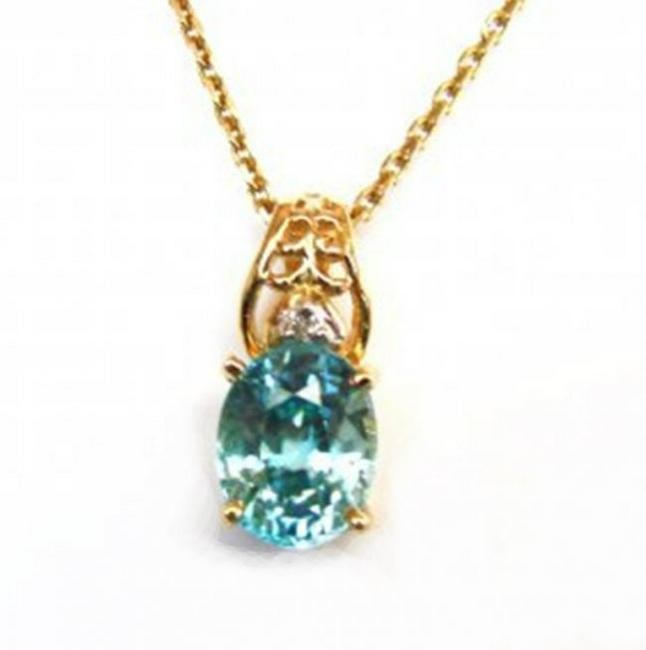 Diamond Blue Zircon Pendant 4.53Ct 14k Y/G: Gem Type: Diamond Blue Zircon Item: Pendant Shape: L3/4" x W1/4"inch Diamond 1 Piece Weight: .03 Carat Round Brilliant Clarity: SI2, Color: H, Treatment: None Hardness: 7.5 Blue Zircon Weight: 4.50