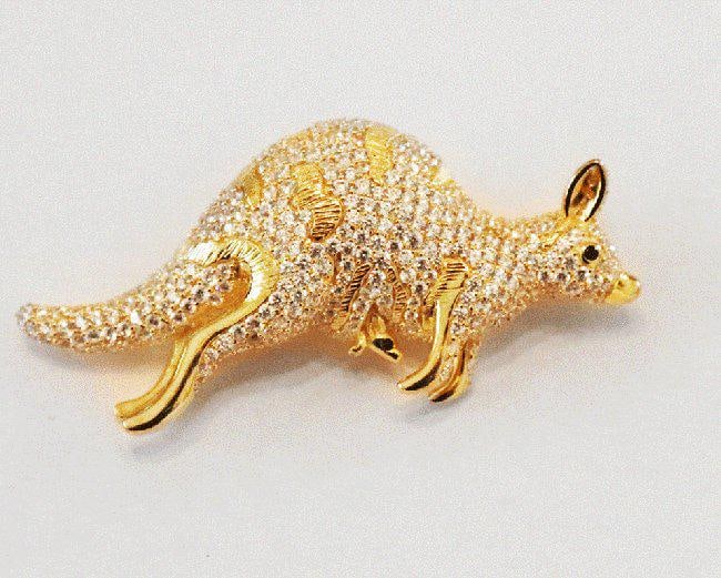 Kangaroo Brooch 18k White Gold Overlay 925: Gem: Creation, Yellow Fancy Diamond Yellow Stone Total: Clarity: VS1, Color: F Length: 2.75 inches Width: 1. Inch Stone: Approximately Weight 51.02 CT Item: Kangaroo Brooch Metal: 16.90 grams 18 Yello