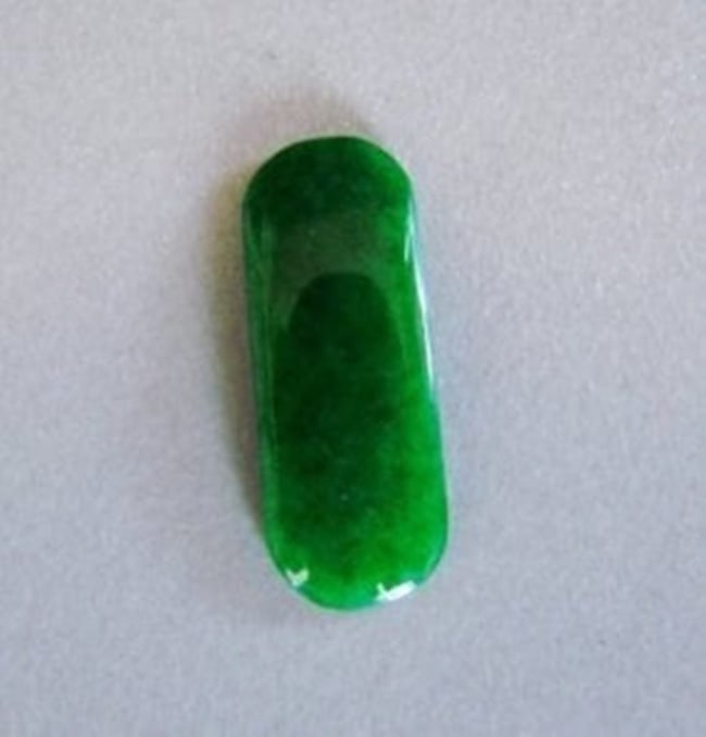 Loose Natural Chinese Jade Grade: A for Pendant or Ring: Gems: Natural Jade Jadeite Qty: 1 Jade Weight: 3.15 carat Oval Cabochon Size: Length: 20.2 x width 8 x Deep 1.5 mm Grade: A Clarity: Transparent Color: Emerald Green, Black spot Treatment: Untreated
