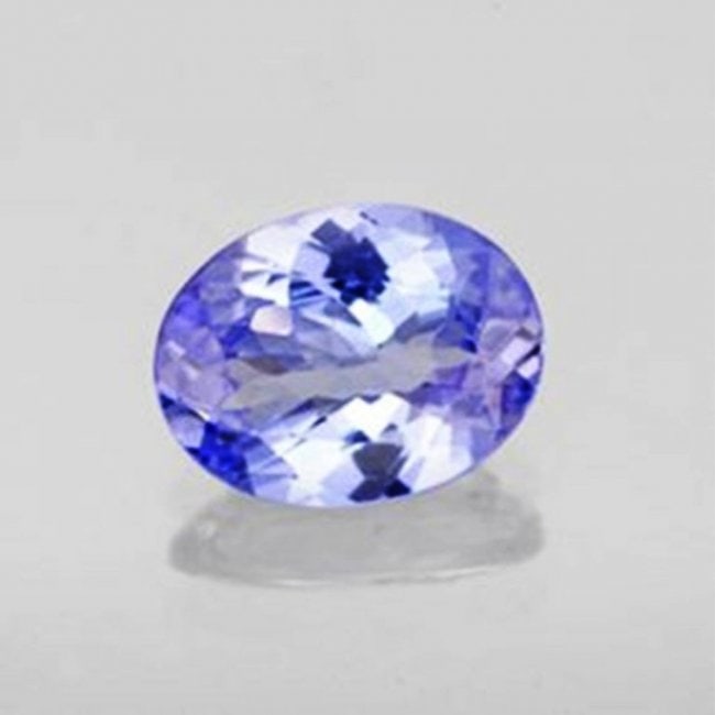 Loose Tanzanite Oval Shape .80Ct 7.5x5.3x2.9 mm: Gem Type: Natural Tanzanite Qty: 1 Weight: .80 Carat Measurement: 7.5x5.3x2.9 mm Shape: Oval Cut: Facet cut Clarity: VVS Color: Light Violet/Blue Treatment: None Origin: Tanzania H